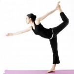 Asian female practising yoga