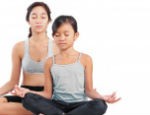 Young girl and a lady in yoga meditation position-198x115